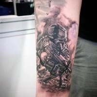 Interesting looking black and gray style forearm tattoo of modern soldier