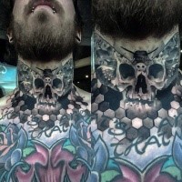 Interesting looking black ink human skull tattoo on neck stylized with butterfly wings