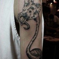 Interesting looking black ink shoulder tattoo of half elephant half goat