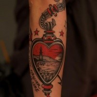 Interesting looking colored arm tattoo of human heart with lettering and lighthouse