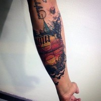 Interesting painted and colored geometrical tattoo on arm