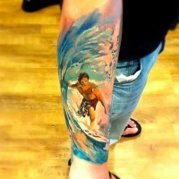 Interesting painted big colored surfer tattoo on arm