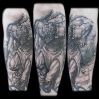 Interesting painted black ink antic man tattoo on forearm