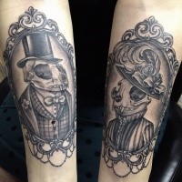 Interesting painted vintage style forearm tattoo of human portraits with animal skulls