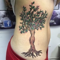 Interesting woman shaped colored fantasy tree tattoo on side area