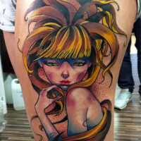 Japanese cartoon style colored thigh tattoo of girl