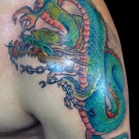 Japanese traditional style colored shoulder tattoo of dragon with chains