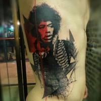 Jimmy Hendrix portrait like colored detailed tattoo on thigh