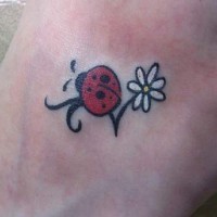 Ladybug and flower tattoo on ankle