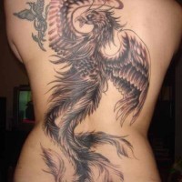 Large and small phoenix tattoo on back