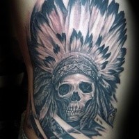 Large black and gray style side tattoo of big Indian skull with big feather helmet