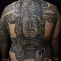 Large black and white whole back tattoo of stone statue