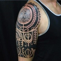 Large black ink Celtic style shoulder tattoo of various ornaments