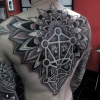 Large black ink dot style whole back tattoo of cool floral ornament
