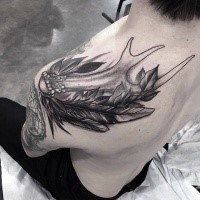 Large black ink vintage style shoulder tattoo of deer horn and feather