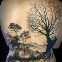 Large black ink whole back tattoo of big forest