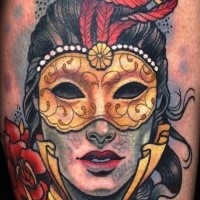 Large colored shoulder tattoo of mystical man with mask and feather