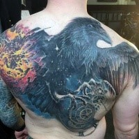 Large colored whole back tattoo of crow with blast and mechanisms