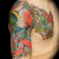 Large coloured japanese dragon tattoo on shoulder