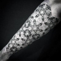 Large dotwork style arm tattoo of floral ornament