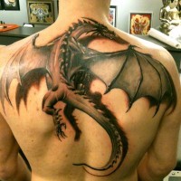 Large fantasy dragon tattoo on back
