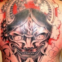 Large hannya mask tattoo on back