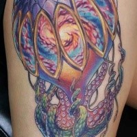 Large illustrative style colored shoulder tattoo of octopus with beautiful balloon