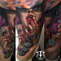 Large illustrative style thigh tattoo of bloody woman with playing card