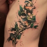 Large illustrative style watercolor side tattoo of birds on tree