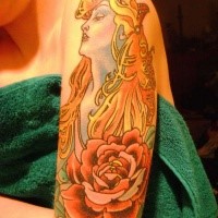 Large interesting looking illustrative style shoulder tattoo of woman with rose flower
