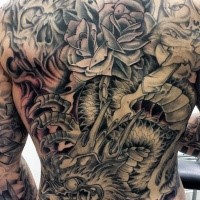 Large japanese style colored whole back tattoo of dragon with rose and playing cards