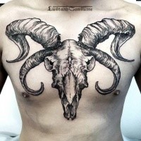 Large linework style chest tattoo of demonic animal skull