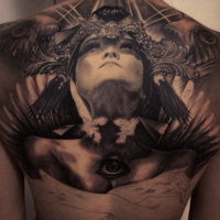 Large mystical back tattoo of ancient woman with pyramids and eye