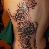 Large black roses tattoo on back by fpista