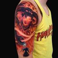 Large very beautiful colored shoulder tattoo of Lord of the Rings demon with wizard