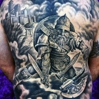 Large very detailed whole back tattoo of medieval warrior with castle