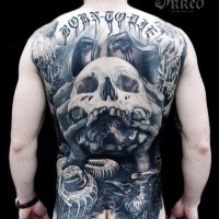 Large very detailed whole back tattoo of creepy woman with human skull and lettering