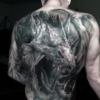Large very detailed whole back tattoo of large dragon head