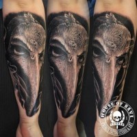Lifelike black and white fantasy bird shaped creature tattoo on forearm