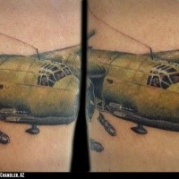 Lifelike colored arm tattoo bomber plane