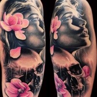 Lifelike very detailed arm tattoo of beautiful woman with skull and pink flowers