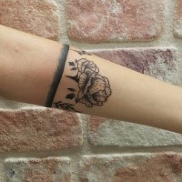 Linework style black ink arm tattoo fo big flower