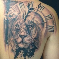 Lion on hourplate tattoo in back