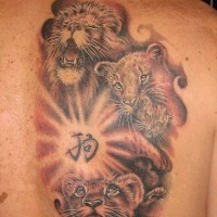 Lion family and hieroglyph tattoo on back