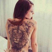 Large lion head tattoo on girl back