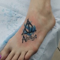 Little 3D style black ink mystical Harry Potter symbol tattoo on foot with lettering