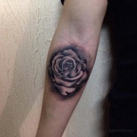 Little 3D style black ink rose flower tattoo on forearm area