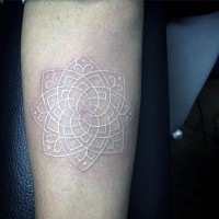 Little beautiful white ink flower tattoo on arm