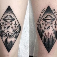Little black and white alien ship with stars tattoo on leg
