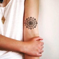 Little black and white arm tattoo of beautiful designed flower